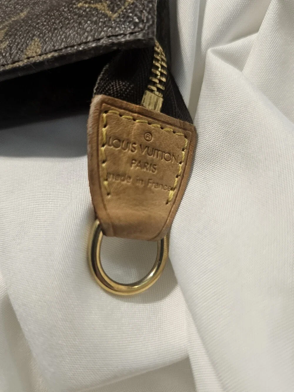 Louis Vuitton monogram zipper corner